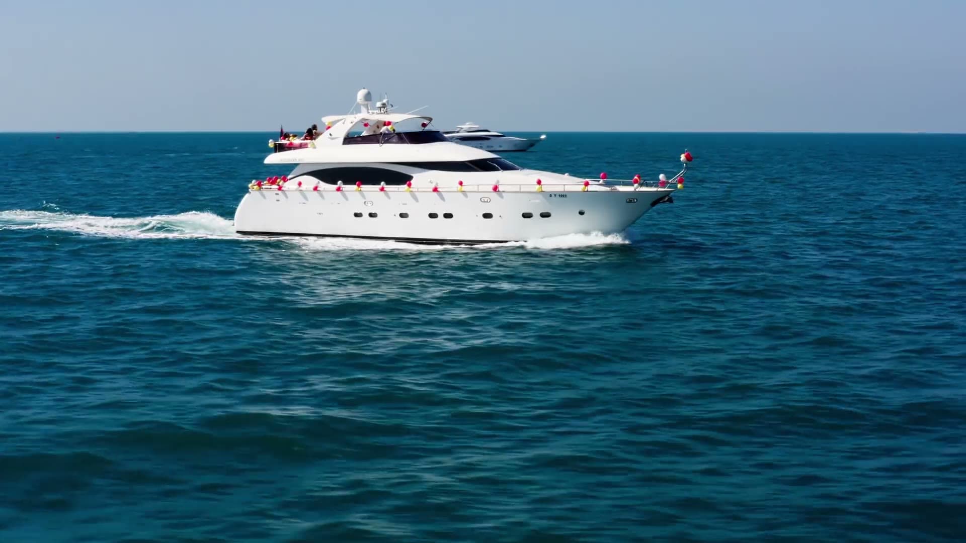 Aerial cinematography of yachts along a Mediterranean coastline